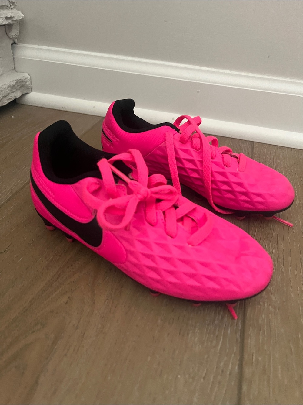 Nike Kids Bright Pink Soccer Cleats with Black Swoosh